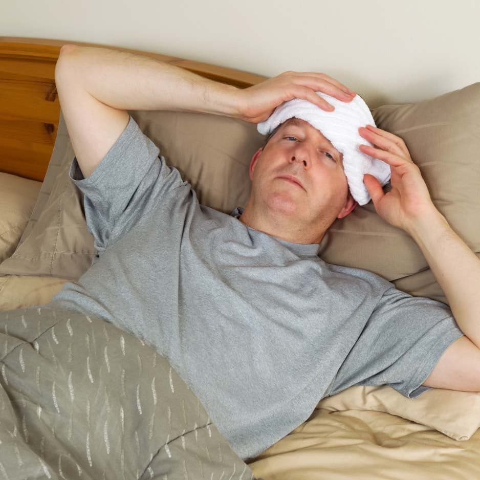 Verzuim, zieke werknemer in bed